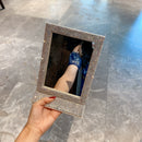 Glitter frame texture captured under directional light to emphasize shimmer effect