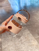 Tumbler resting on marble surface with soft natural lighting