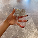 Comparison of full vs. half-filled blue spray bottle showing accurate 60mL capacity scale