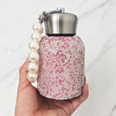 Side angle of Nordic Pink insulated tumbler showing curved silhouette and matte finish