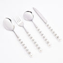 Close-up of pearl-style texture on stainless steel spoon handle