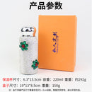 Close-up of stainless steel base showing engraved logo and material texture