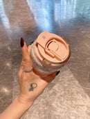 Silicone straw removed and laid beside tumbler for scale reference