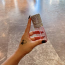 Minimalist Nordic-style vanity setup featuring white spray bottle and matching skincare items