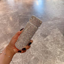 Tumbler next to coffee beans and espresso cup for lifestyle context