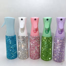 Lifestyle image of mist spray bottle beside skincare products on marble vanity