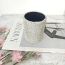 Multicolor version of round leather desk organizer with assorted brushes inside