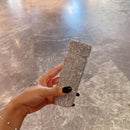 Close-up of base showing engraved brand mark and stability ring