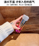 Tumbler inside small backpack side pocket demonstrating portability