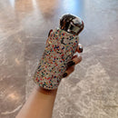 Top-down view of rainbow star tumbler with vibrant multi-color crystal pattern