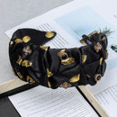 Lifestyle shot of black headband worn with loose wavy hair