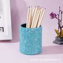 Pink leather desk organizer with rhinestones, styled on wooden desk with pens