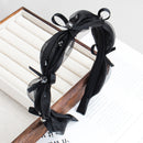 Front view of SUUMEE mesh hair band in heather gray on white background