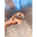 Close-up detail of ice-crack texture on green glass tumbler wall