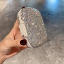 Detail of engraved 'M', 'A', 'E' labels inside each daily compartment