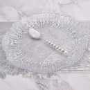 Detail of mirror-polished finish reflecting ambient light on knife blade