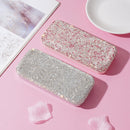 Front view of silver-white crystal embellished leather eyewear case on white background