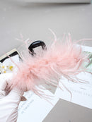 Clip styled in a romantic low chignon for wedding-ready look