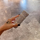 Tumbler held against natural daylight to emphasize crystal sparkle