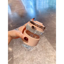 Top-down shot showing tumbler lid open with silicone straw extended