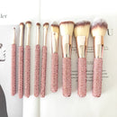 Macro shot of wooden handle grain and engraved SUUMEE logo detail