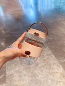 Stacked pair of tumblers — pink and green — showing color contrast