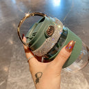 Tumbler paired with matching coasters on light oak table