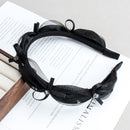 Side angle showing narrow width and delicate crystal placement on mesh headband