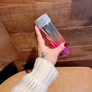 Overhead photo of tumbler beside keys and phone for real-world scale