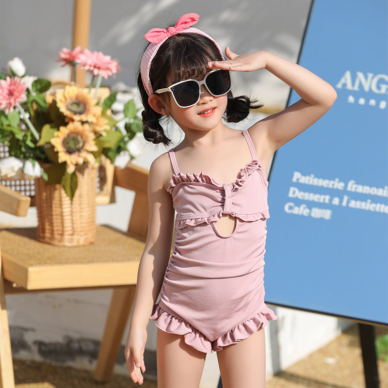 The suspender one-piece swimsuit is cute and playful